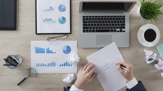 Crisis at work, businessman trying to create new successful business strategy