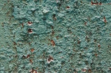 Grunge styled rusty old green and brown iron wall backgrounds of outdoor textured old damaged steel...