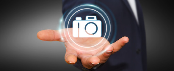 Businessman using modern camera application 3D rendering