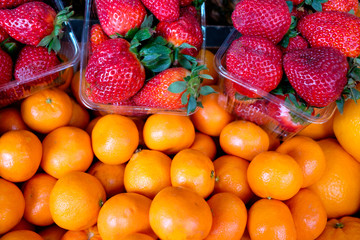 strawberry and mandarins in market
