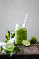 Refreshing green cocktail with lime and spinach