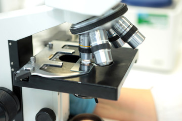 Medical microscope. Professional pharmaceutical microscope. Study of the properties of the drug when increasing. The person analyzes the components of the medicine.