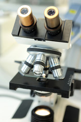 Medical microscope. Professional pharmaceutical microscope. Study of the properties of the drug when increasing. The person analyzes the components of the medicine.