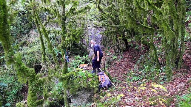 The old pilgrim read the prayer at holy spring 