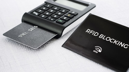 RFID protection sleeve for secure credit card from hacking, TAN generator with card on middle ground