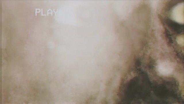 Fake VHS tape: a zombie, devil or ghoul is looking at the viewer through a thick smoke. Concept: nightmare, fear, phobia, hell, afterlife.
