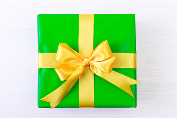 Gift box with yellow bow. Blue present package.