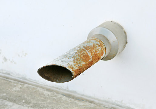 Rusty industrial drain pipe