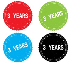 3 YEARS text, on round wavy border stamp badge.