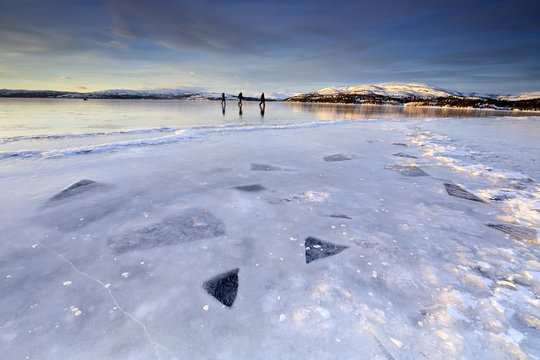 Hikers on the frozen lake of Limingen Rorvik B&Atilde;&cedil;rgefjell National Park Tr&Atilde;&cedil;ndelag Norway Europe