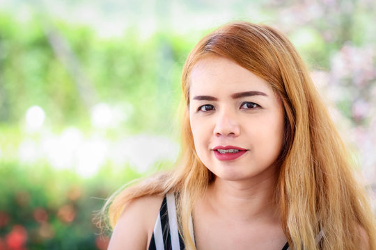 Portrait of Thai beautiful lady with red lip and blonde hair