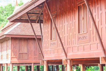 Fototapeta na wymiar Exterior of Thai style house with roof top