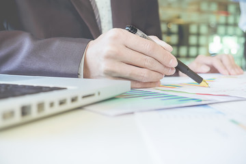 The above view of business man discussing data at meeting