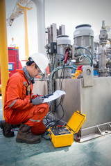 Technician,Instrument technician on the job calibrate or function check pneumatic control valve in process oil and gas platform offshore,technician