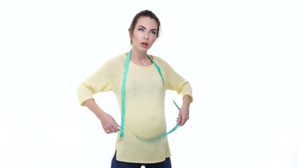 Beautiful pregnant woman measuring her belly and showing thumbs up gesture isolated on a white background - Powered by Adobe