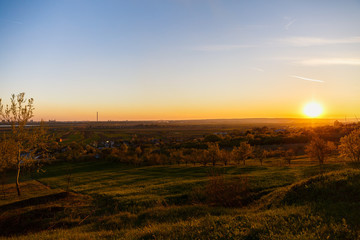Obraz premium beautiful sunset over a field in rural country Romania