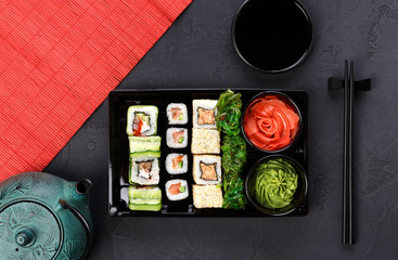 Sushi and rolls top view in japanese restaurant