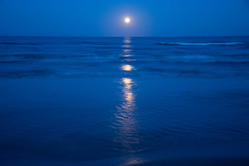 Sunset and the moon rising on the Mediterranean coast in southern Spain