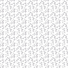 Gentle seamless pattern. Tracery of swirls and decorative leaves isolated on a white background. Vintage style. It can be used for printing on fabric, wallpaper, wrapping