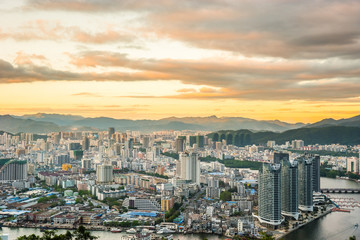 Sanya town evening cityscape, view from Luhuitou Park on Hainan Island of China.