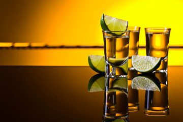 Mexican Gold Tequila in short glasses with lime