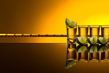 Mexican Gold Tequila in short glasses with lime