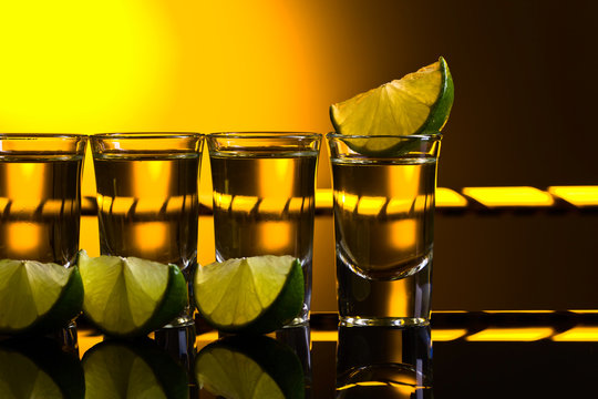 Mexican Gold Tequila in short glasses with lime