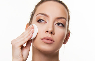 Woman remove make up with pad