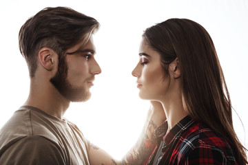 Tender portrait of man and woman facing each other.