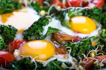 Fried eggs with vegetables.