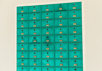 row of green mailboxs