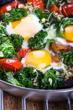 Fried eggs with vegetables.