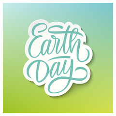 Earth Day holiday card with handwritten text design on blurred background. Hand drawn lettering. Vector illustration.