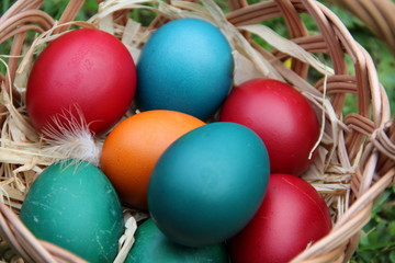 Fototapeta na wymiar Colored Easter Eggs on a straw 