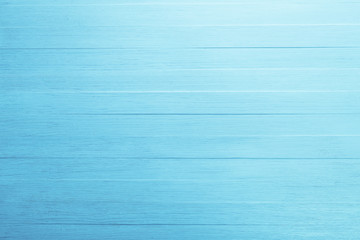 Blue wood background. Painted scraped wooden board. Bright texture or pattern.