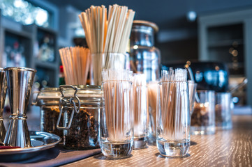 Classic bar counter with bottles in blurred background