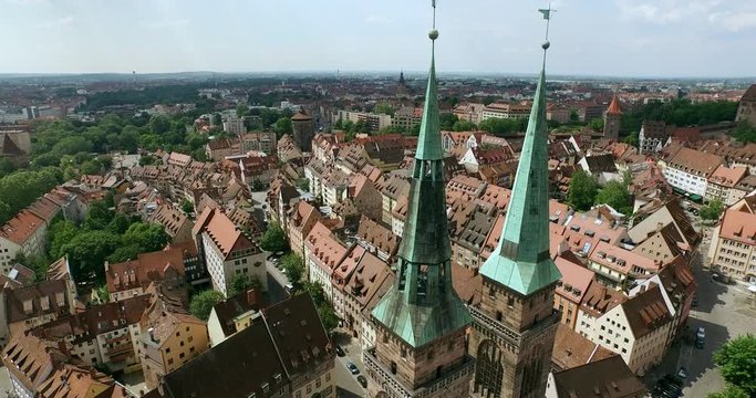 The towers of the Sebalduskirche in Nuremberg. Flight close to the roofs of the church Sebaldus in Nürnberg, Germany.