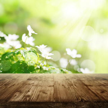 Spring background with flowers and wooden table
