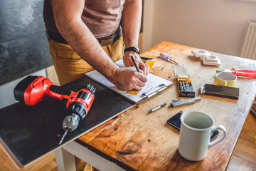 Man making draft plan using pencil