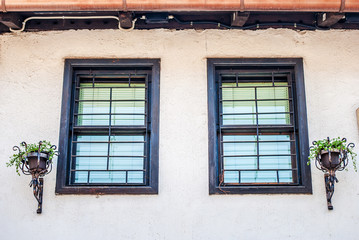 Part of the facade with traditional Bosnian houses with small windows from the Ottoman period