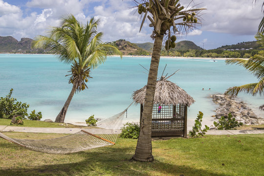 Hammock And Palm Trees Surrounded By The Caribbean Sea Ffryes Beach Sheer Rocks Antigua And Barbuda Leeward Island West Indies