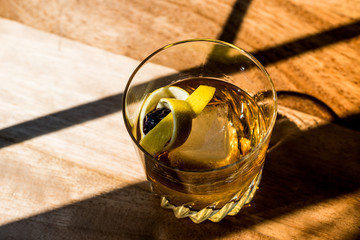Old Fashioned Cocktail with lemon peel and ice