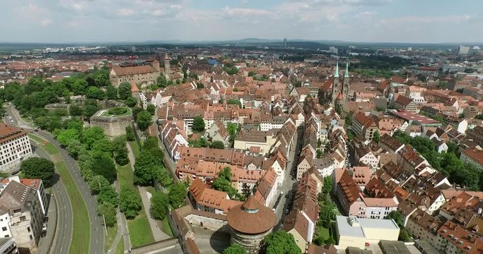 N&uuml;rnberg. Aerial shot showing the outer city wall and flying into the old city of Nuremberg in Germany on a sunny day.
