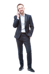 Young man in suit using smart phone