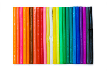 Colorful plasticine on white background. Rainbow colors