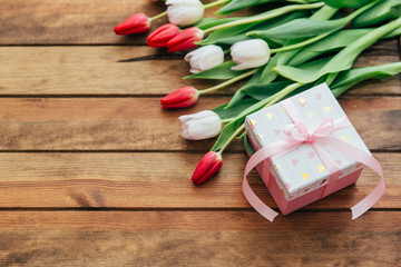 Beautiful tulips over wooden background. Mothers day concept 