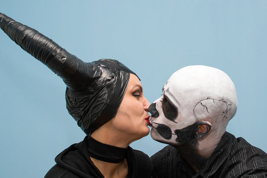 Halloween couple in traditional costumes and makeup