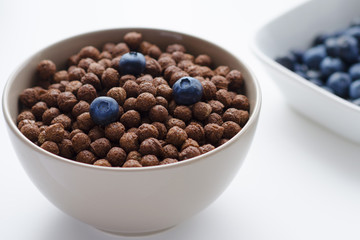 Bowl of cocoa cerals with blueberries