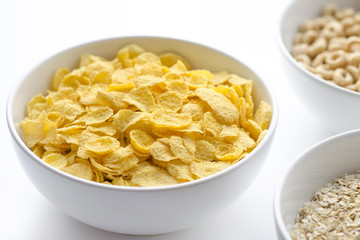 Bowl of cornflakes on white background
