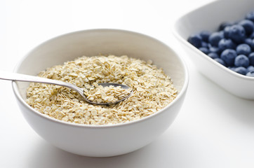 Bowl of oats close up with spoon